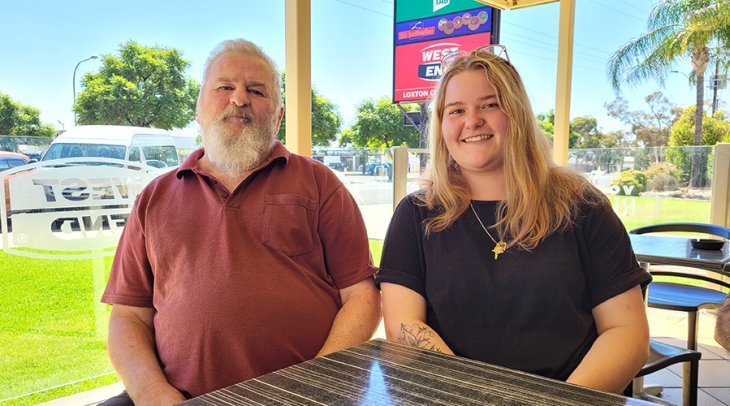 Male NDIS participant being supported in his community by a female Enhanced Lifestyles Disability Support Worker.